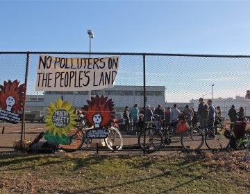 Protesters gather in a parking lot at the Philadelphia Energy Solutions refinery office on Passayunk Avenue in South Philadelphia on Feb. 9, 2020. (Emma Lee/WHYY)